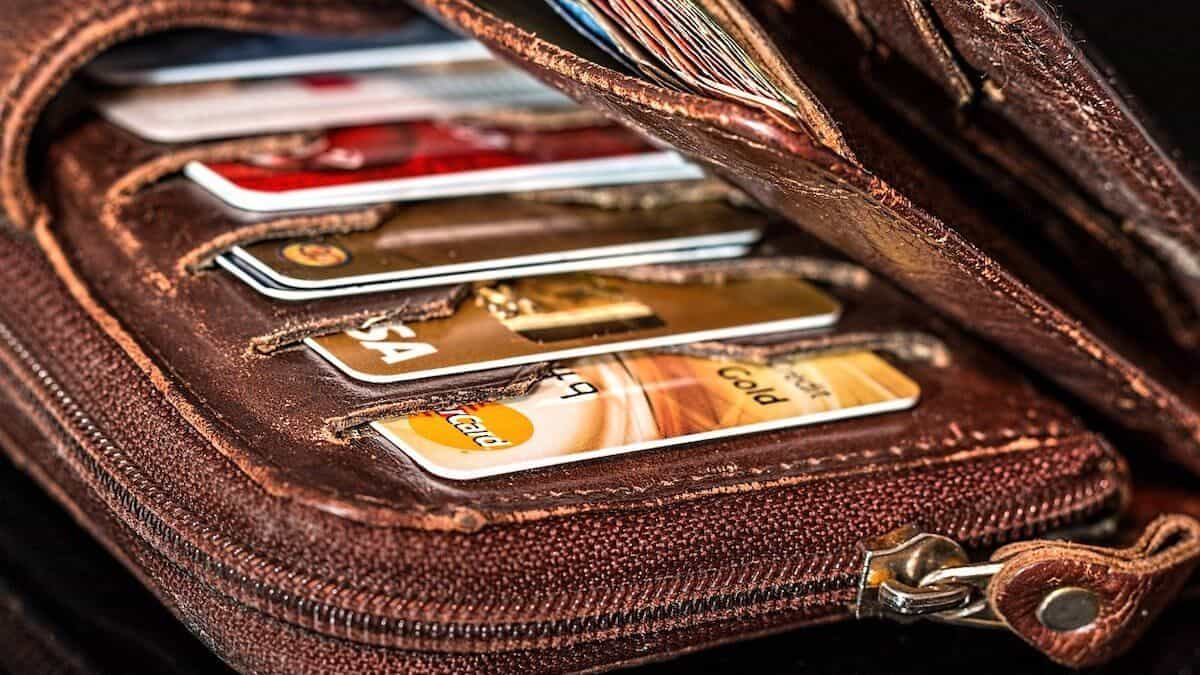 the wallet of someone who is drowning in debt