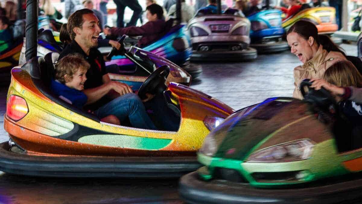 bumper cars with parents and toddlers in a southern california amusement park