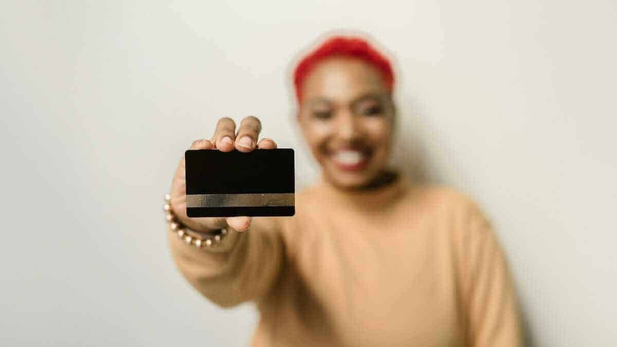 a woman holding a gift card