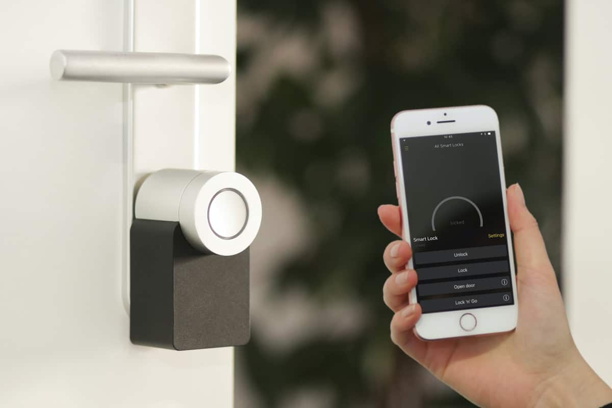 gold Apple iPhone smartphone showing smarthome lock