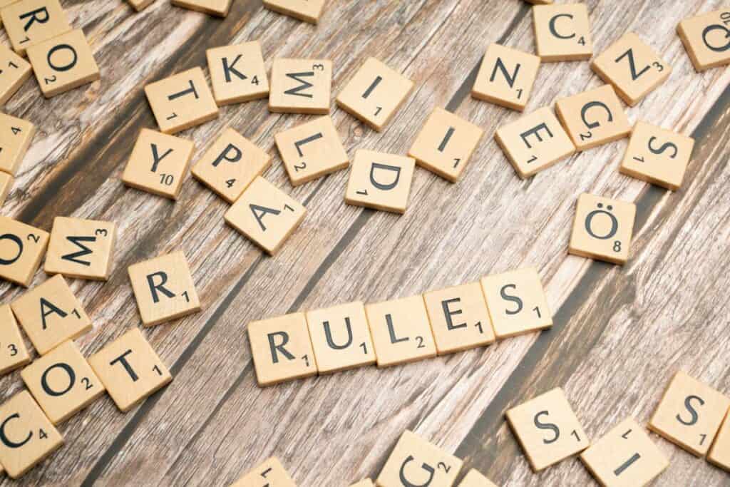 scrabble tiles spelling out rules
